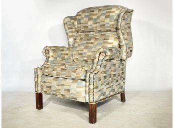 A Modern Reclining Wing Back Chair With Nailhead Trim By Beacon Hill