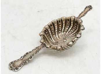 An Antique Sterling Silver Tea Strainer