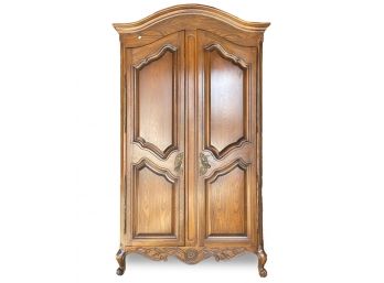 A Vintage Carved Oak Armoire In French Provincial Style