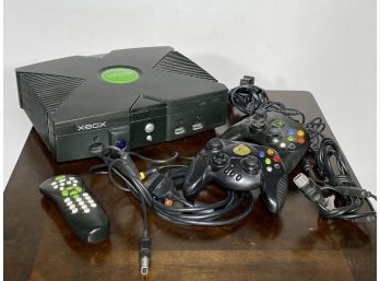 An Xbox And Assorted Accessories