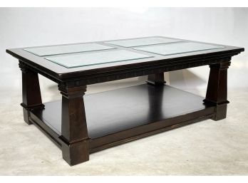 A Spanish Style Coffee Table With Glass Top