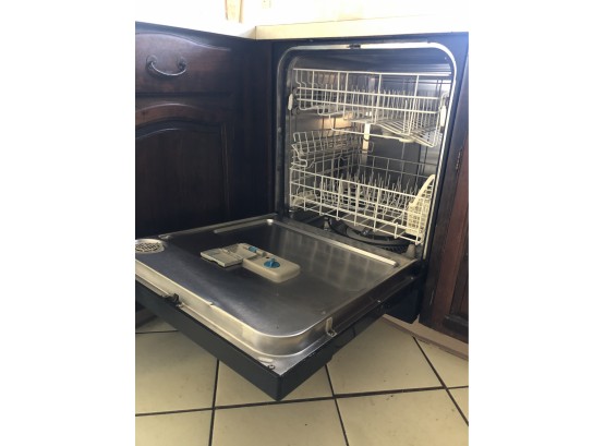 A Kitchen Aid Dishwasher With Black Panel