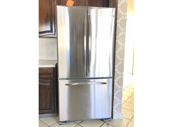A GE Profile Stainless Steal Side By Side Refrigerator Freezer