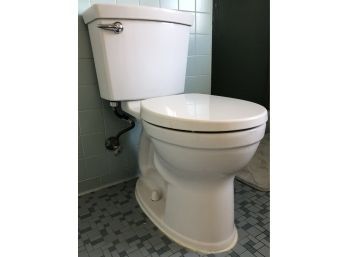 An American Standard White Toilet - Primary