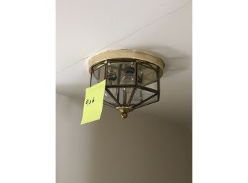A Glass And Brass Ceiling Fixture