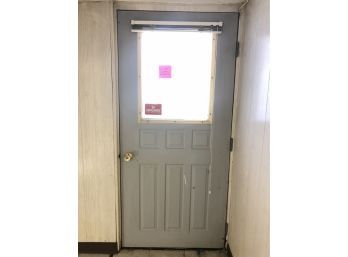 A Metal Exterior Basement Door