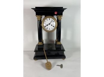 A FRENCH EMPIRE MANTLE CLOCK WITH PORCELAIN DIAL AND ORMALU MOUNTS, 12' X 6.5' X 19'