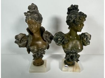 A PAIR OF BRONZE PATINATED BUSTS OF WOMEN ON MARBLE PLINTHS, 11' EACH
