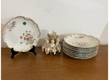 A GERMAN FIGURAL VASE AND EIGHT FRENCH PORCELAIN 8' LUNCHEON PLATES
