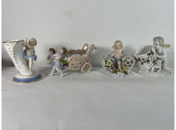 FOUR GERMAN PORCELAIN FIGURAL VASES WITH CHERUBS, 10' AND SMALLER