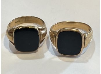 TWO 10K GOLD AND ONYX MEN'S RINGS, 14.08 GRAMS