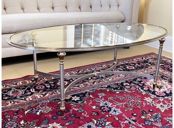 A Classical Silver And Brass Tone Metal Coffee Table With Oval Glass Top