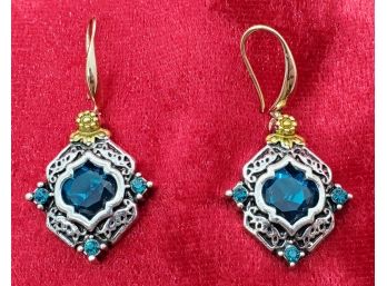 Silver And Gold Tone Earrings In A Victorian Style Setting With Blue Rhinestones