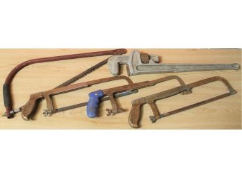 Lot Of Hand Saws And Large Plumber's Pipe Wrench