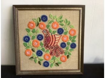 Stitched Art Of A Bird And Blue And Orange Flowers