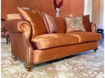 A Sofa With Glamorous Marmalade Upholstery And Nailhead Trim By Greenbaum Interiors