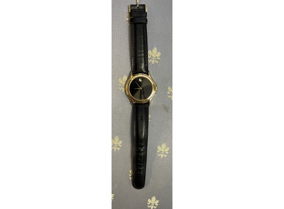 Mans Movado Wrist Watch. Gold Plated  . 8 Inches Long . Swiss Movado On The Lower Face .