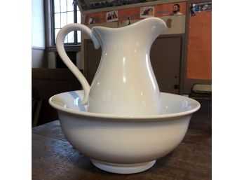 A Ceramic Pitcher And Bowl