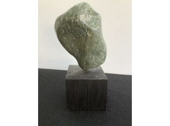 Marbled Green Stone On Wooden Block