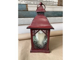 A Holiday Berry And Pine Battery Operated Candle Lantern