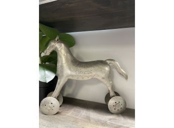 A Large Tin Horse On Wheels