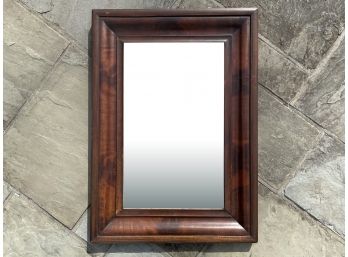 An Antique Mahogany Ogee Mirror