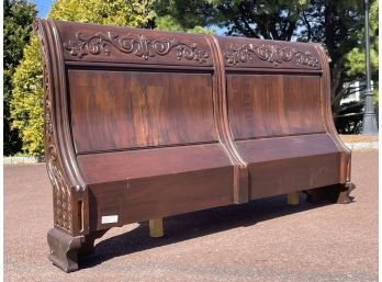 A Carved Mahogany Queen Sleigh Headboard By Wellington Hall