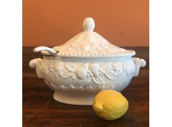 A Cast White Porcelain Tureen With Ladel