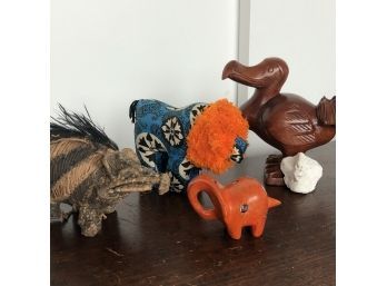A Collection Of Unique Animals In Different Mediums And A Small Sculpture