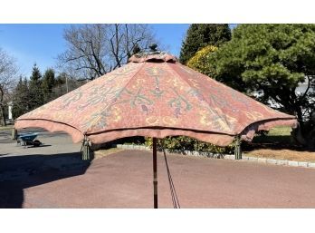 A Canvas Print Market Umbrella With Decorative Tassels