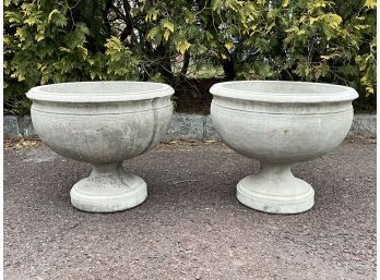 A Pair Of Cast Stone Footed Urns By Campania