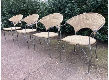 A Set Of 4 Wicker And Wrought Iron Arm Chairs