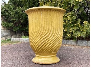 A Large Glazed Earthenware Planter With Spiral Motif