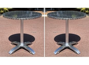 A Pair Of Brushed Aluminum Tilt Top Bistro Tables