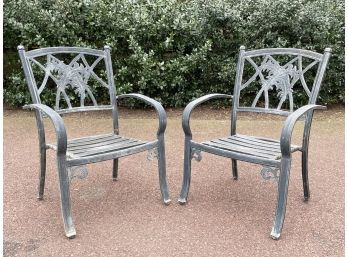 A Pair Of Vintage Cast Aluminum Arm Chairs By Cast Classics