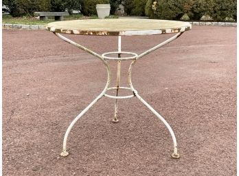 A Vintage Wrought Iron Bistro Table With Glass Top
