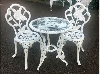 A Vintage Cast Iron Bistro Set With Glass Top Table
