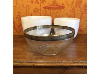 A Glass Salad Bowl With Silver Rim And 2 White Ceramic Bowls