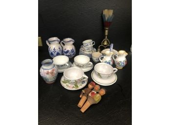 An Array Of Ceramic Demi Tass Cups And Italian Carved Corks