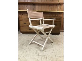 A Wooden Folding Director's Chair With Removable Canvas Slings