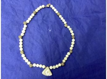 Sterling Silver Bead Necklace With A Polished Shell Pendant