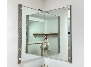 A Pair Of Mirrors With Lights