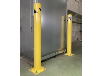 A Pair Of Metal Safety Bollards