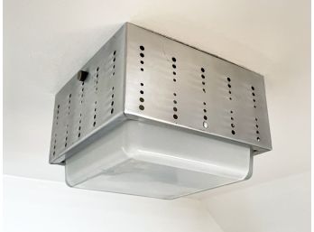 A Perforated Metal Surface Mounted Light