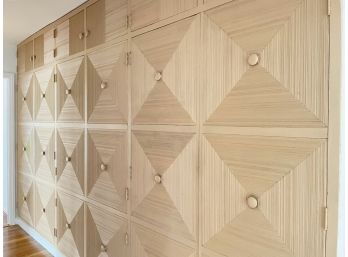 A Closet System With Intricately Carved Wood Doors