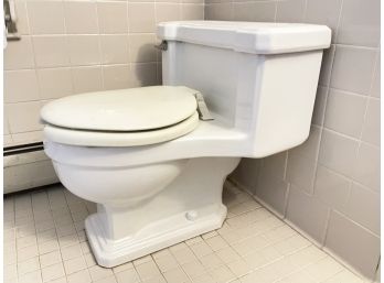A 1 Piece American Standard Toilet, Basement