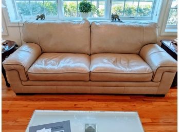 Off-white Leather Couch With Nice Stitching Around Border (color Is A Shade Of Beige)