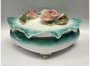 A Porcelain Keepsake Box With A Turquoise Ruffle Rim & Handpainted Flowers