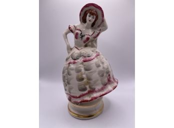A Beautiful Handpainted Figurine With Gilded Detail