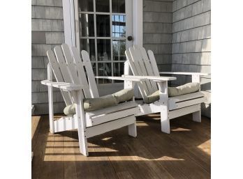 A Pair Of Wood Adirondack Chairs